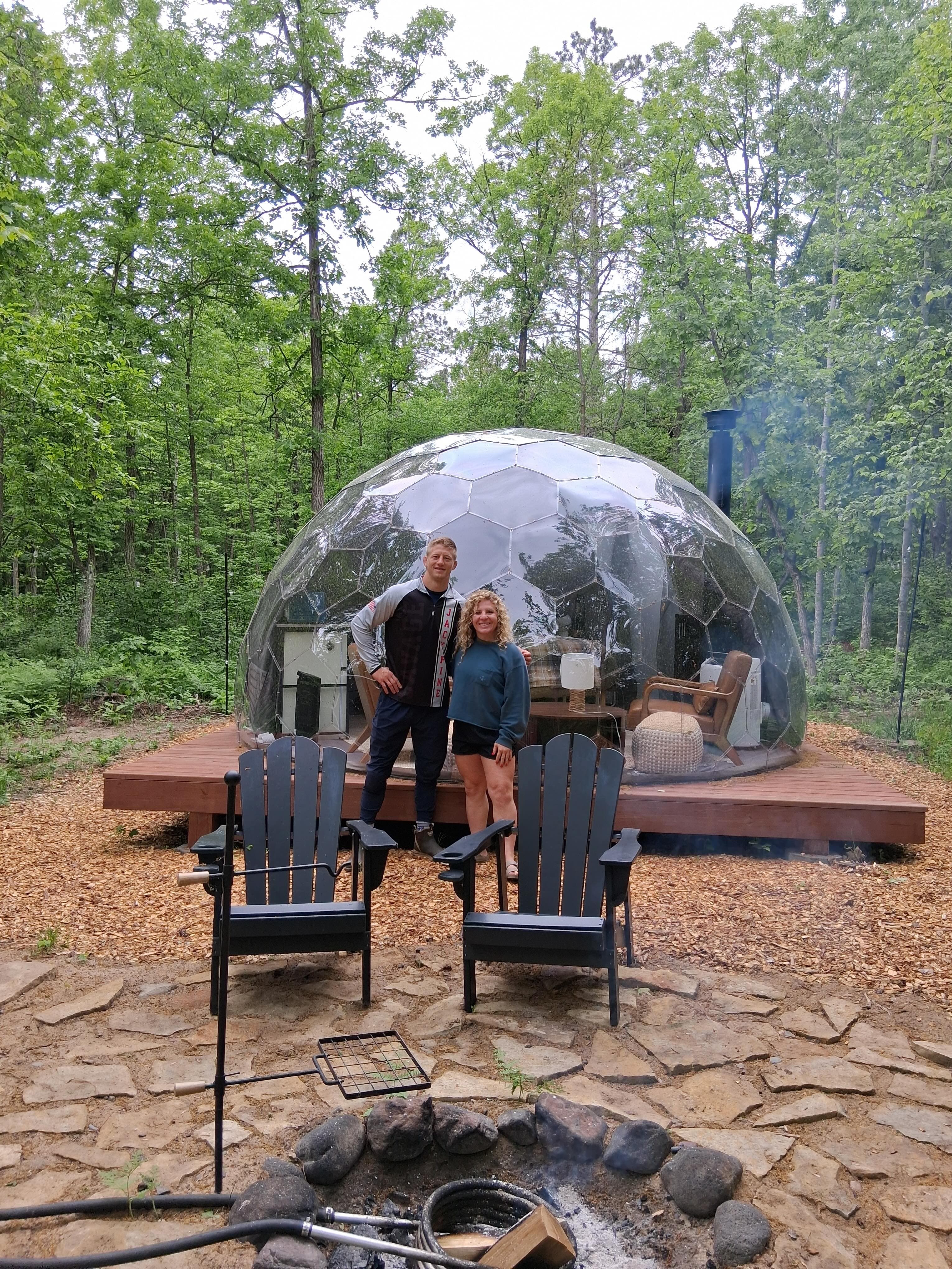 Guests at the geodesic dome in the forest